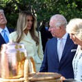 US President Donald Trump, First Lady Melania Trump, Britain's King Charles III and Britain's Queen Camilla look at a display as they tour the White House beehive on the South Lawn of the White House in Washington, DC, on April 27, 2026. (Photo by Su