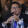Dewan Pengawas Indonesian Mining Association, Raden Sukhyar menyampaikan pemaparan dalam acara EV Transition in Mining Industry Outlook 2026 di Jakarta, Rabu (29/4/2026). (CNBC Indonesia/Tri Susilo)