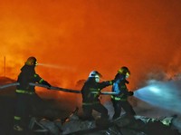 Firefighters work to distinguish a fire following a blast at a fireworks manufacturing factory in Liuyang, Hunan province, China, May 5, 2026. cnsphoto via REUTERS )