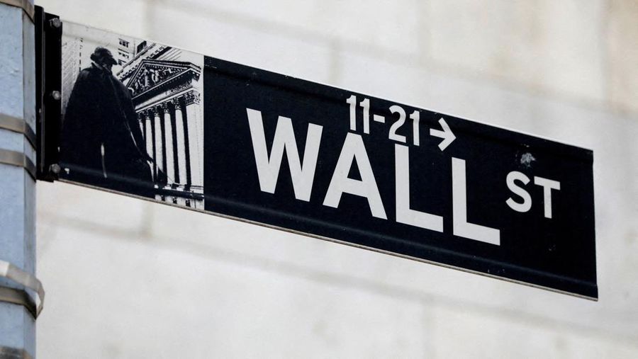 FILE PHOTO: A street sign for Wall Street is seen outside of the New York Stock Exchange (NYSE) in New York City, New York, U.S., June 28, 2021. REUTERS/Andrew Kelly//File Photo