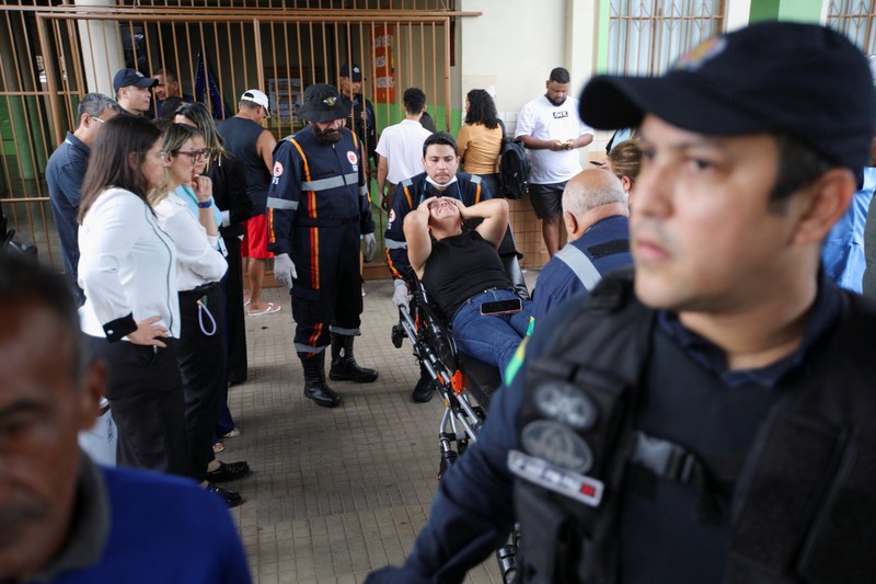 Policemen patrol after a shooting at a Sao Jose school, where two staff members were killed, the Acre state government confirmed in a statement, in Rio Branco, Brazil, May 5, 2026. REUTERS/Sergio Vale