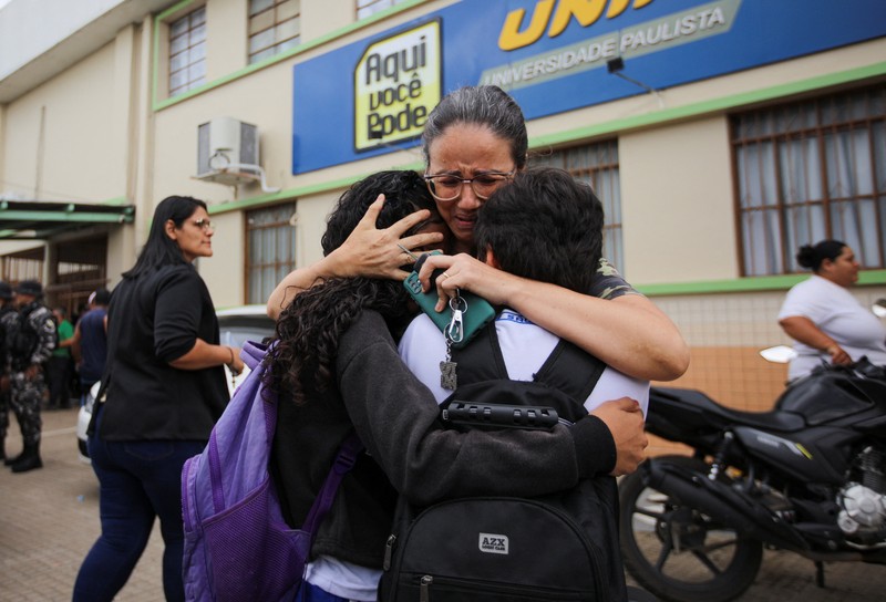 Policemen patrol after a shooting at a Sao Jose school, where two staff members were killed, the Acre state government confirmed in a statement, in Rio Branco, Brazil, May 5, 2026. REUTERS/Sergio Vale