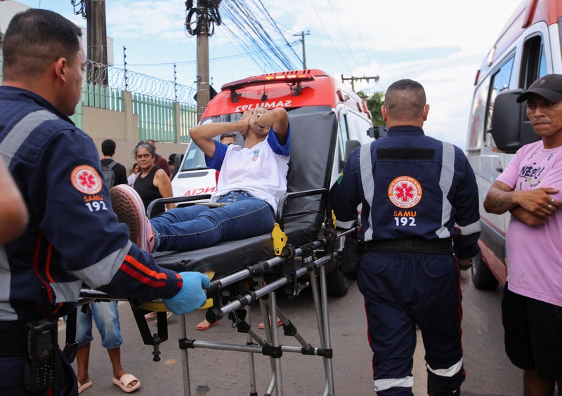 Policemen patrol after a shooting at a Sao Jose school, where two staff members were killed, the Acre state government confirmed in a statement, in Rio Branco, Brazil, May 5, 2026. REUTERS/Sergio Vale