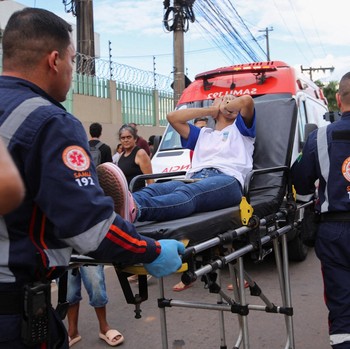 Emergency responders carry a student after a shooting at a Sao Jose school, where two staff members were killed, the Acre state government confirmed in a statement. in Rio Branco, Brazil, May 5, 2026. REUTERS/Sergio Vale
