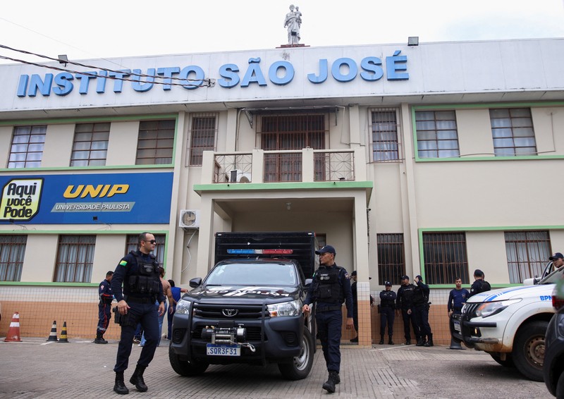 Policemen patrol after a shooting at a Sao Jose school, where two staff members were killed, the Acre state government confirmed in a statement, in Rio Branco, Brazil, May 5, 2026. REUTERS/Sergio Vale