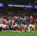 Soccer Football - UEFA Champions League - Semi Final - Second Leg - Arsenal v Atletico Madrid - Emirates Stadium, London, Britain - May 5, 2026 Arsenal's Myles Lewis-Skelly with teammates celebrate after reaching the UEFA Champions League final REUTE