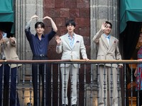 Members of South Korean Kpop boy band BTS and Mexico's President Claudia Sheinbaum react as they stand on a balcony of the National Palace ahead of a series of concerts on the BTS World Tour "Arirang" in Mexico City, Mexico, May 6, 2026. REUTERS/Luis