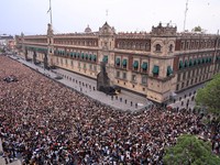 Fans of South Korean Kpop boy band BTS, known as ARMY, gather at Zocalo Square as they wait for members of the group alongside Mexico's President Claudia Sheinbaum to appear on a balcony of the National Palace, ahead of concerts on their "Arirang" wo