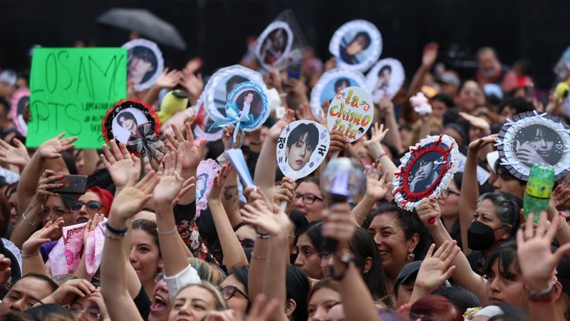 Fans of South Korean Kpop boy band BTS, known as ARMY, react on the day members of the band meet with Mexico's President Claudia Sheinbaum at the National Palace ahead of a series of concerts on the BTS World Tour