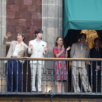 Mexico's President Claudia Sheinbaum and members of South Korean Kpop boy band BTS react as they stand on a balcony of the National Palace ahead of a series of concerts on the BTS World Tour "Arirang" in Mexico City, Mexico, May 6, 2026. REUTERS/Luis
