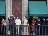 Mexico's President Claudia Sheinbaum and members of South Korean Kpop boy band BTS react as they stand on a balcony of the National Palace ahead of a series of concerts on the BTS World Tour "Arirang" in Mexico City, Mexico, May 6, 2026. REUTERS/Luis