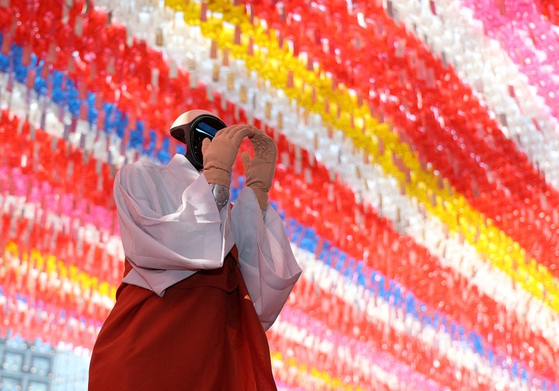 Humanoid robot Gabi folds its hands during a precept ceremony at a temple in Seoul, South Korea, May 6, 2026.    Yonhap via REUTERS   THIS IMAGE HAS BEEN SUPPLIED BY A THIRD PARTY. NO RESALES. NO ARCHIVES. SOUTH KOREA OUT. NO COMMERCIAL OR EDITORIAL SALES IN SOUTH KOREA.
