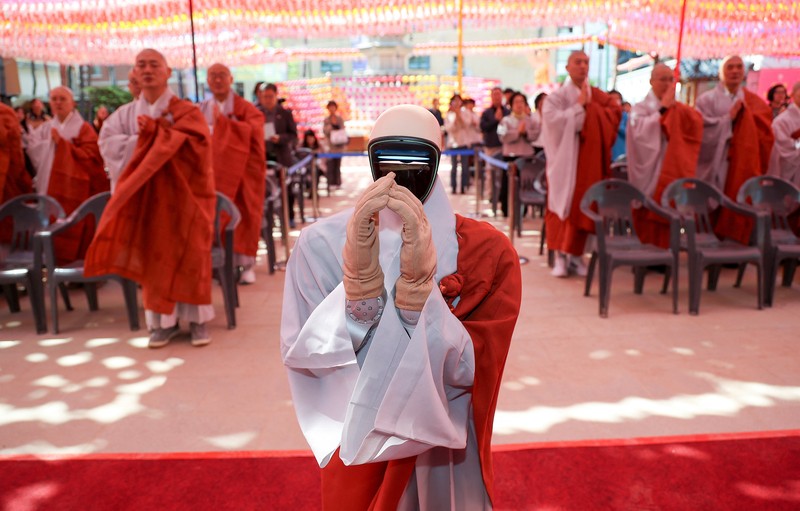 Humanoid robot Gabi folds its hands during a precept ceremony at a temple in Seoul, South Korea, May 6, 2026.    Yonhap via REUTERS   THIS IMAGE HAS BEEN SUPPLIED BY A THIRD PARTY. NO RESALES. NO ARCHIVES. SOUTH KOREA OUT. NO COMMERCIAL OR EDITORIAL SALES IN SOUTH KOREA.