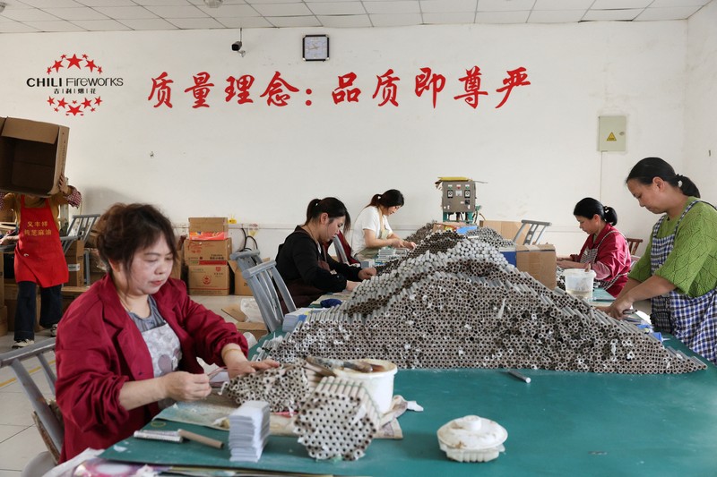 Employees work to assemble firework products at Chili Fireworks factory in Liling, Hunan province, China, April 10, 2026.  REUTERS/Go Nakamura
