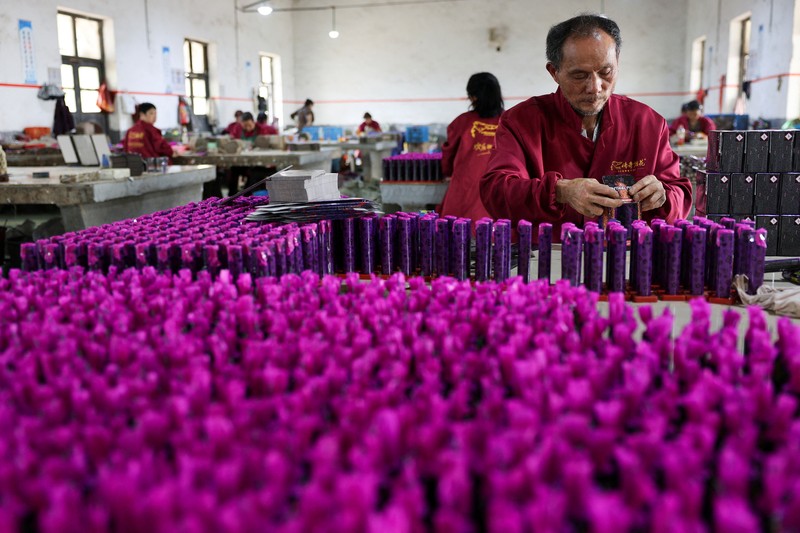 Employees work to assemble firework products at Chili Fireworks factory in Liling, Hunan province, China, April 10, 2026.  REUTERS/Go Nakamura