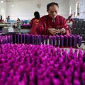 Employees work to assemble firework products at Chili Fireworks in Liling, Hunan province, China, April 10, 2026.  REUTERS/Go Nakamura