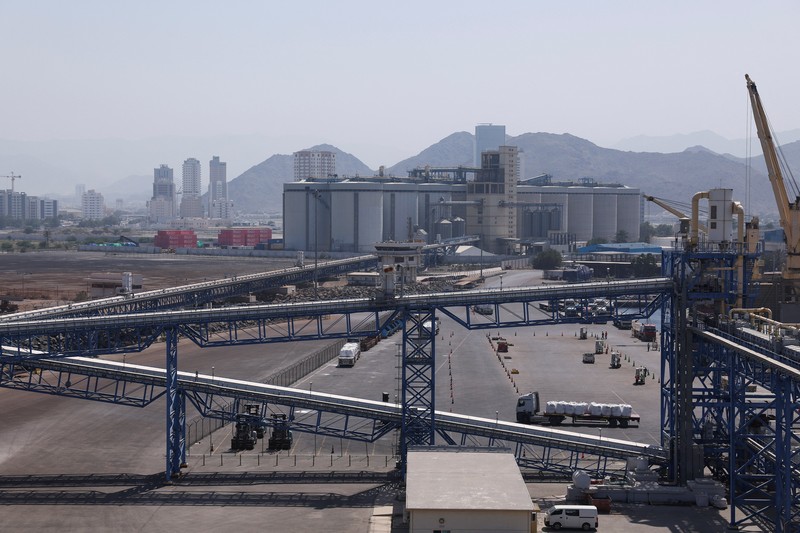 A man walks at the Port of Fujairah, as the U.S.-Israel conflict with Iran limits marine traffic in the Strait of Hormuz, in Fujairah, United Arab Emirates, May 6, 2026. REUTERS/Amr Alfiky