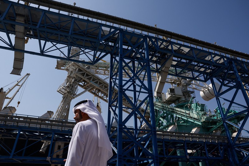 A man walks at the Port of Fujairah, as the U.S.-Israel conflict with Iran limits marine traffic in the Strait of Hormuz, in Fujairah, United Arab Emirates, May 6, 2026. REUTERS/Amr Alfiky