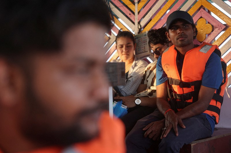 Tithi Chiranjeevi, an Indian seafarer who was stuck in Iran during the conflict, travels on a ferry in Mumbai, India, May 6, 2026. REUTERS/Francis Mascarenhas     TPX IMAGES OF THE DAY