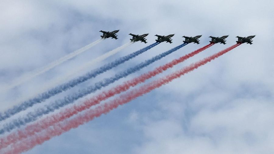 Russia's Su-25 jet aircraft release smoke in the colours of the Russian state flag during a flypast rehearsal for a military parade, which marks the 81st anniversary of victory over Nazi Germany in World War Two, in central Moscow, Russia, May 6, 202