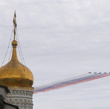Russia's Su-25 jet aircraft release smoke in the colours of the Russian state flag during a flypast and a military parade on Victory Day, marking the 81st anniversary of the victory over Nazi Germany in World War Two, in central Moscow, Russia, May 9
