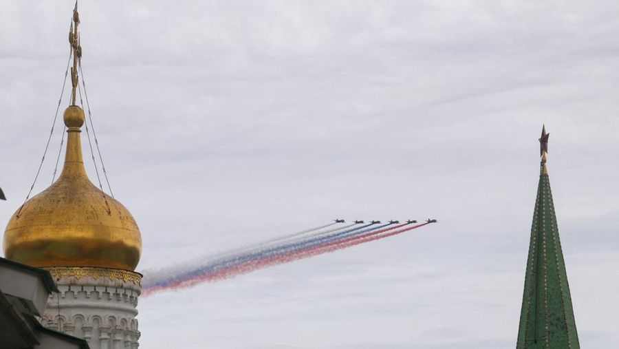 Russia's Su-25 jet aircraft release smoke in the colours of the Russian state flag during a flypast and a military parade on Victory Day, marking the 81st anniversary of the victory over Nazi Germany in World War Two, in central Moscow, Russia, May 9