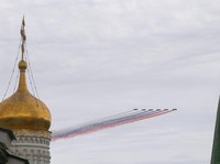 Russia's Su-25 jet aircraft release smoke in the colours of the Russian state flag during a flypast and a military parade on Victory Day, marking the 81st anniversary of the victory over Nazi Germany in World War Two, in central Moscow, Russia, May 9