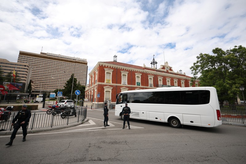 A bus carrying passengers of the cruise ship MV Hondius, which was affected by a hantavirus outbreak, at the Gomez Ulla Military Hospital, in Madrid, Spain, May 10, 2026. REUTERS/Alejandro Martinez Velez