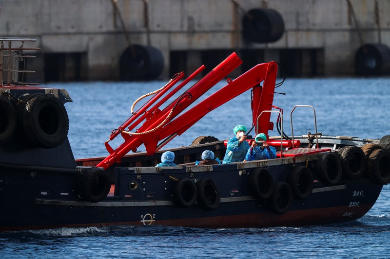 A Spanish coast guard boat operates next to cruise ship MV Hondius at the port of Granadilla de Abona after being affected by a hantavirus outbreak, in Tenerife, Spain, May 10, 2026. REUTERS/Hannah McKay