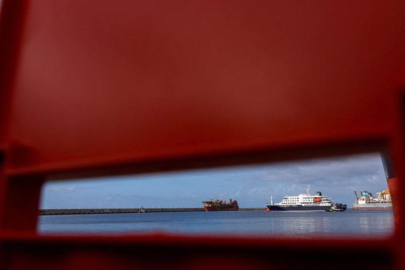 A Spanish coast guard boat operates next to cruise ship MV Hondius at the port of Granadilla de Abona after being affected by a hantavirus outbreak, in Tenerife, Spain, May 10, 2026. REUTERS/Hannah McKay