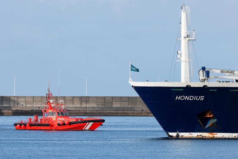 A Spanish coast guard boat operates next to cruise ship MV Hondius at the port of Granadilla de Abona after being affected by a hantavirus outbreak, in Tenerife, Spain, May 10, 2026. REUTERS/Hannah McKay