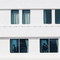 People aboard the cruise ship MV Hondius, which is affected by a hantavirus outbreak, at the port of Granadilla de Abona in Tenerife, Spain, May 10, 2026. REUTERS/Hannah McKay