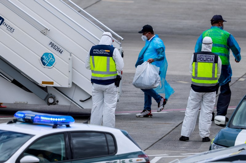 A bus carrying passengers of the cruise ship MV Hondius, which was affected by a hantavirus outbreak, at the Gomez Ulla Military Hospital, in Madrid, Spain, May 10, 2026. REUTERS/Alejandro Martinez Velez