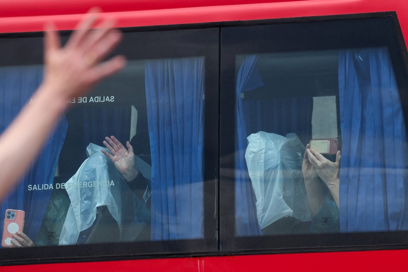 A bus carrying passengers of the cruise ship MV Hondius, which was affected by a hantavirus outbreak, at the Gomez Ulla Military Hospital, in Madrid, Spain, May 10, 2026. REUTERS/Alejandro Martinez Velez