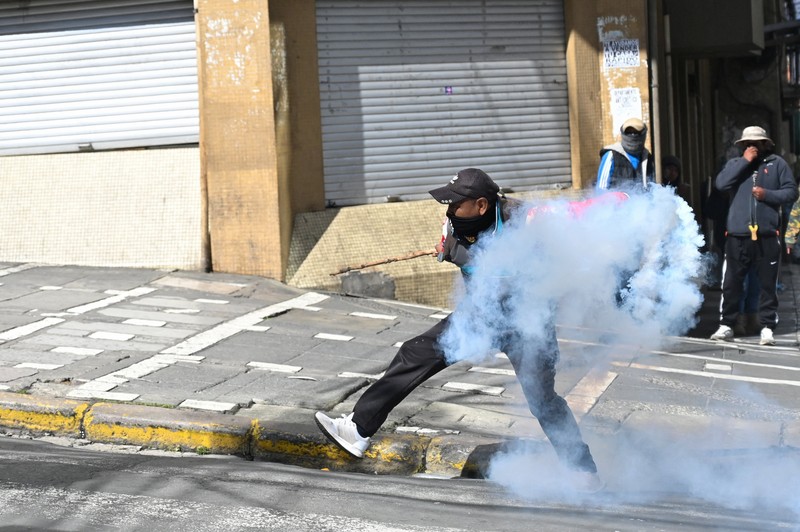 Security forces use tear gas during nationwide protests aiming to press Bolivian President Rodrigo Paz's government to roll back austerity measures and address rising costs of living, in Apacheta, Bolivia, May 23, 2026. REUTERS/Claudia Morales