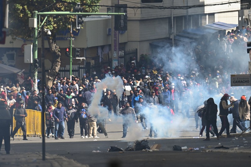 Security forces use tear gas during nationwide protests aiming to press Bolivian President Rodrigo Paz's government to roll back austerity measures and address rising costs of living, in Apacheta, Bolivia, May 23, 2026. REUTERS/Claudia Morales