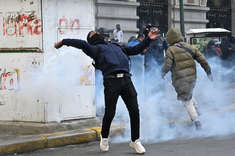Security forces use tear gas during nationwide protests aiming to press Bolivian President Rodrigo Paz's government to roll back austerity measures and address rising costs of living, in Apacheta, Bolivia, May 23, 2026. REUTERS/Claudia Morales