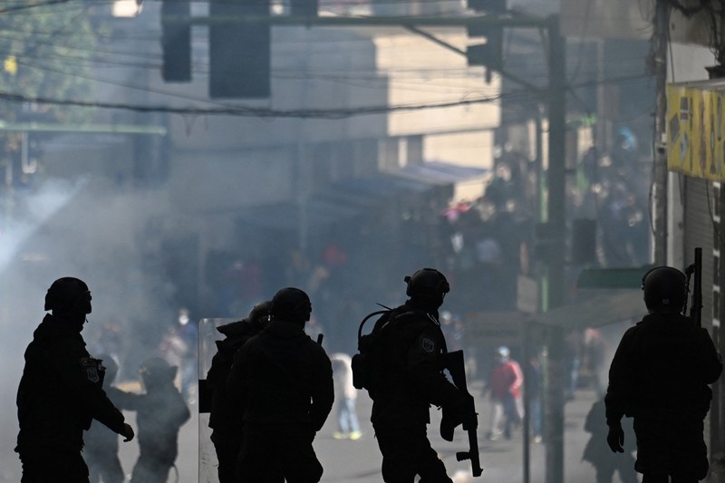 Security forces use tear gas during nationwide protests aiming to press Bolivian President Rodrigo Paz's government to roll back austerity measures and address rising costs of living, in Apacheta, Bolivia, May 23, 2026. REUTERS/Claudia Morales