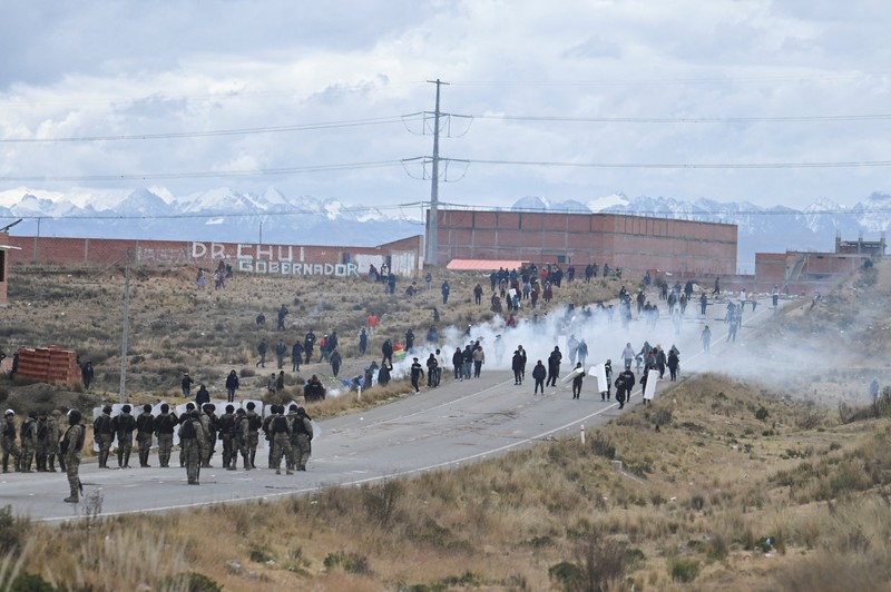 Security forces use tear gas during nationwide protests aiming to press Bolivian President Rodrigo Paz's government to roll back austerity measures and address rising costs of living, in Apacheta, Bolivia, May 23, 2026. REUTERS/Claudia Morales