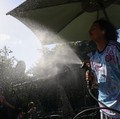 A worker sprays water on people passing by in Buttes Chaumont park, as temperatures reached up to 35 degrees Celsius, during a period of hot weather in Paris, France, May 25, 2026. REUTERS/Tom Nicholson