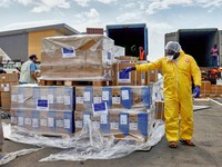 UNICEF staff and airport workers load trucks with aid from the European Civil Protection and Humanitarian Aid Operations (ECHO) for the Ebola outbreak caused by the Bundibugyo strain, at Bunia National Airport in Bunia, Ituri province, Democratic Rep