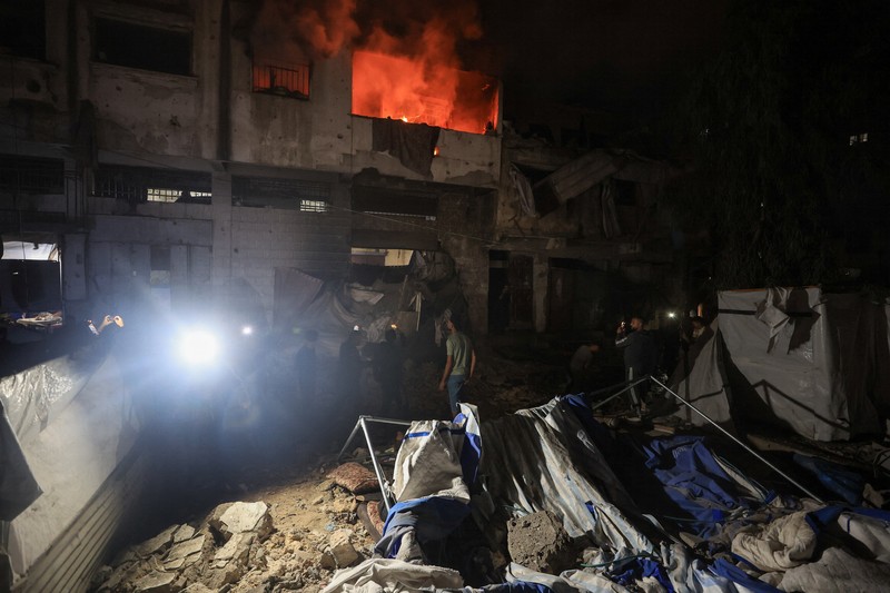 Smoke rises from a residential building following an Israeli strike, in Gaza City, May 27, 2026. REUTERS/Dawoud Abu Alkas