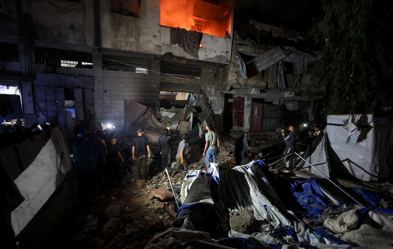 Smoke rises from a residential building following an Israeli strike, in Gaza City, May 27, 2026. REUTERS/Dawoud Abu Alkas