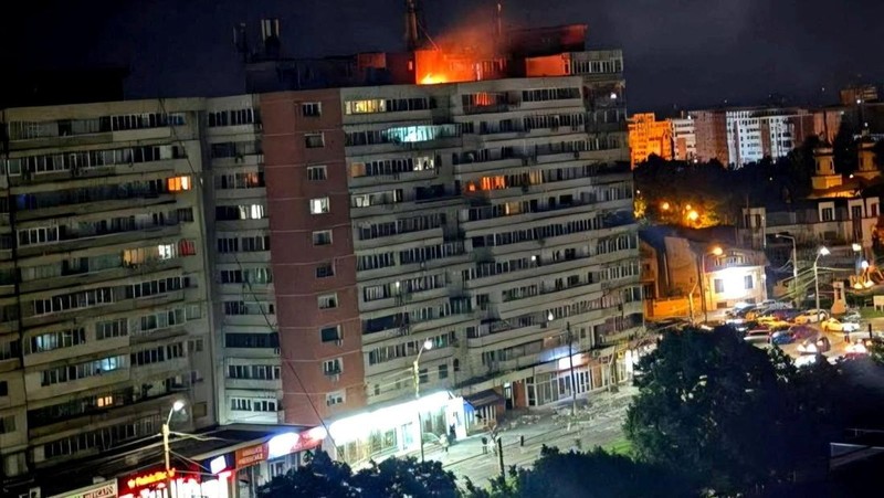 A fire burns on the roof of a 10-story block of flats after a drone crashed into the building, causing an explosion and injuring two people, near the border with Ukraine, in Galati, Romania, in this handout image released on May 29, 2026. Romanian De