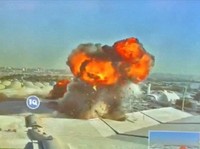 Rekaman CCTV menunjukkan api dan asap yang mengepul setelah serangan di Bandara Internasional Kuwait, di Kota Kuwait, Kuwait pada 3 Juni 2026, dalam cuplikan layar dari video ini. (Civil Aviation Kuwait/Handout via REUTERS)