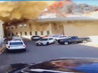 Rekaman CCTV menunjukkan sebuah mobil meninggalkan tempat parkir saat api dan asap mengepul setelah serangan di Bandara Internasional Kuwait di Kota Kuwait, Kuwait, 3 Juni 2026, dalam cuplikan video ini. (Civil Aviation Kuwait/Handout via REUTERS)