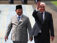 German President Frank-Walter Steinmeier waves as Indonesian President Prabowo Subianto reacts next to him during a welcoming ceremony upon their meeting at the Merdeka Palace in Jakarta, Indonesia, June 15, 2026. REUTERS/Willy Kurniawan