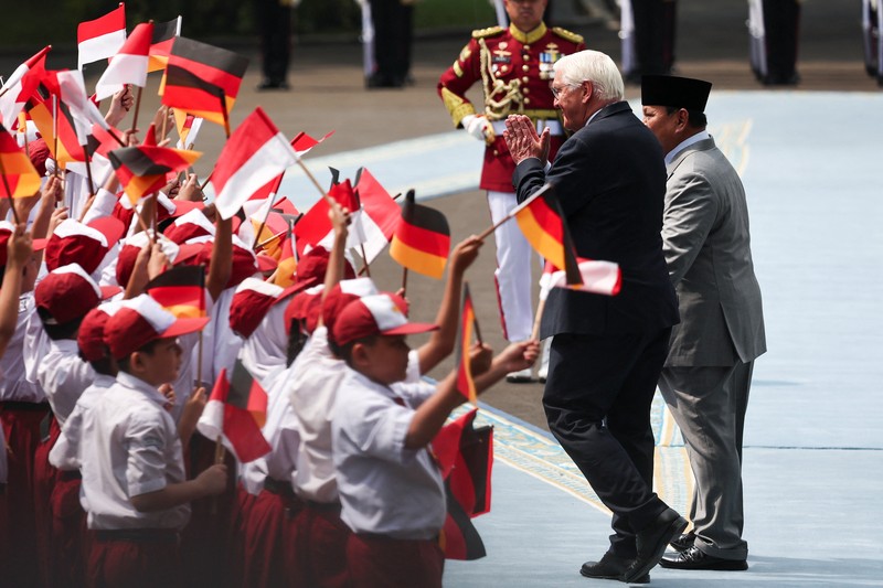 Indonesian President Prabowo Subianto and German President Frank-Walter Steinmeier walk during a welcoming ceremony upon their meeting at the Merdeka Palace in Jakarta, Indonesia, June 15, 2026. REUTERS/Willy Kurniawan