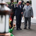 German President Frank-Walter Steinmeier, accompanied by Indonesian President Prabowo Subianto, gestures as he is welcomed by a traditional dance show upon their meeting at the Merdeka Palace in Jakarta, Indonesia, June 15, 2026. REUTERS/Willy Kurnia