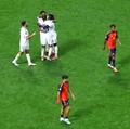 Soccer Football - FIFA World Cup 2026 - Group H - Spain v Cape Verde - Atlanta Stadium, Atlanta, Georgia, U.S. - June 15, 2026 Cape Verde players celebrate as Spain's Pau Cubarsi and Martin Zubimendi look dejected after the match REUTERS/Bernadett Sz